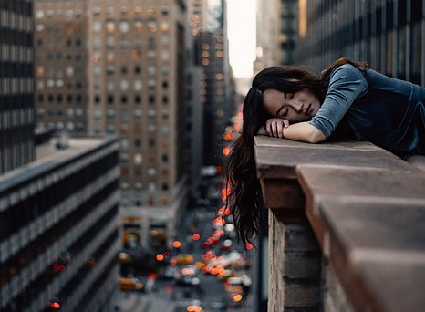 girl sleeping in city
